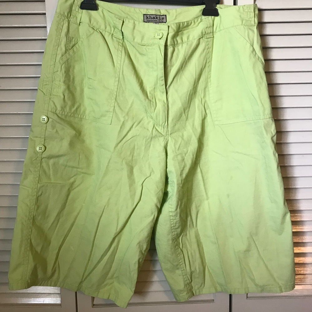 Green cargo shorts that come to or past the knees